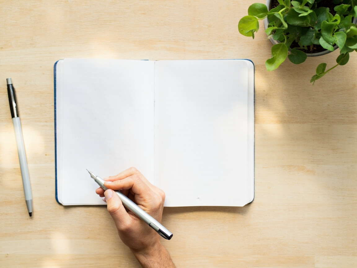 Entrepreneur writing the foundational questions that form their marketing blueprint strategy